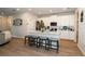 The kitchen offers white cabinetry, stainless appliances and a breakfast bar at 26082 Woven Wicker Bnd, Lutz, FL 33559