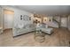 Open concept living room with kitchen and staircase view at 26082 Woven Wicker Bnd, Lutz, FL 33559