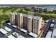 Aerial shot of a condo building showing parking, balconies, and the surrounding cityscape with water views at 2621 Cove Cay Dr # 309, Clearwater, FL 33760