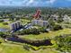 Breathtaking aerial view presents condo buildings with surrounding golf courses, lakes, and verdant landscapes at 2621 Cove Cay Dr # 309, Clearwater, FL 33760