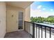 The private balcony offers a glimpse of the beautiful community and lush surroundings at 2621 Cove Cay Dr # 309, Clearwater, FL 33760