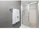 Bathroom featuring a sliding glass shower door and towel rack at 2621 Cove Cay Dr # 309, Clearwater, FL 33760