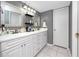 Bathroom features double vanity, framed mirrors, and storage at 2621 Cove Cay Dr # 309, Clearwater, FL 33760