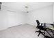 Bedroom featuring tile flooring, a closet, and a ceiling fan at 2621 Cove Cay Dr # 309, Clearwater, FL 33760