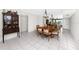Traditional dining room with a large table, classic china cabinet, and bright, neutral decor at 2621 Cove Cay Dr # 309, Clearwater, FL 33760
