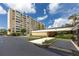 The condo's exterior features well-maintained landscaping and convenient parking near the entrance at 2621 Cove Cay Dr # 309, Clearwater, FL 33760