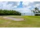 Bunker on the golf course with green grass at 2621 Cove Cay Dr # 309, Clearwater, FL 33760