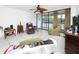 Comfortable living room with a ceiling fan, neutral color scheme, and a relaxing view to the exterior at 2621 Cove Cay Dr # 309, Clearwater, FL 33760