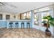 Community lounge with bar seating and views of the pool area and surrounding landscape at 2621 Cove Cay Dr # 309, Clearwater, FL 33760