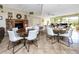 Community meeting room with tables, chairs, and a cozy fireplace, perfect for gatherings at 2621 Cove Cay Dr # 309, Clearwater, FL 33760