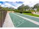 Shuffleboard courts surrounded by mature trees and beautiful landscaping at 2621 Cove Cay Dr # 309, Clearwater, FL 33760