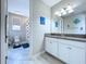 Bathroom featuring white cabinets and a vibrant shower curtain at 2798 Hilliard Dr, Wesley Chapel, FL 33543