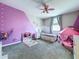 bedroom featuring a fun pink ceiling fan and a cozy play tent at 2798 Hilliard Dr, Wesley Chapel, FL 33543