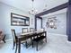 Inviting dining room featuring modern chandelier, large mirror, and decorative wall art, perfect for Gathering gatherings at 2798 Hilliard Dr, Wesley Chapel, FL 33543