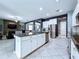 Open-concept kitchen with stainless steel appliances, granite countertops, and an island with bar seating at 2798 Hilliard Dr, Wesley Chapel, FL 33543