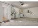 Utility room showcasing a washer, dryer, water heater, and ample storage space at 310 Arbor E Dr, Palm Harbor, FL 34683