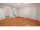 Spacious bedroom with hardwood floors and access to the en-suite bathroom and walk-in closet at 310 Arbor E Dr, Palm Harbor, FL 34683