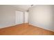 Empty bedroom with laminate flooring, a closet, and freshly painted walls at 310 Arbor E Dr, Palm Harbor, FL 34683