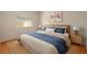 Comfortable bedroom featuring a queen-sized bed, neutral decor, and ample natural light at 310 Arbor E Dr, Palm Harbor, FL 34683
