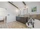 Stylish bathroom featuring double vanity with granite countertops, wood tile flooring, and natural lighting at 311 12Th N Ave, St Petersburg, FL 33701