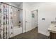 Bright bathroom featuring a shower with a tiled wall and Disney-themed shower curtain at 311 12Th N Ave, St Petersburg, FL 33701