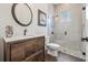Modern bathroom featuring a glass-enclosed shower, decorative mirror, and wood vanity at 311 12Th N Ave, St Petersburg, FL 33701