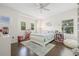 Bright bedroom with two windows, hardwood floors, and a cozy area rug at 311 12Th N Ave, St Petersburg, FL 33701
