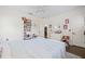 Bright, charming bedroom featuring a plush rug, decorative wall decals, and white furniture accents at 311 12Th N Ave, St Petersburg, FL 33701