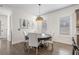 Cozy dining room featuring a round table with upholstered chairs and modern lighting at 311 12Th N Ave, St Petersburg, FL 33701