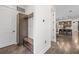 Welcoming entryway with hardwood floors, built-in storage, and view into kitchen at 311 12Th N Ave, St Petersburg, FL 33701