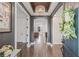 Elegant foyer featuring hardwood floors, an arched doorway, and a decorative chandelier at 311 12Th N Ave, St Petersburg, FL 33701