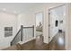 Upstairs hallway featuring hardwood floors and an open view into a bedroom and bonus space at 311 12Th N Ave, St Petersburg, FL 33701