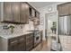 Well-appointed kitchen with stainless steel range, granite countertops, and dark wood cabinetry at 311 12Th N Ave, St Petersburg, FL 33701