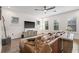 Bright living room with hardwood floors, a ceiling fan, and a comfortable leather sofa at 311 12Th N Ave, St Petersburg, FL 33701