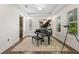 Elegant living room featuring a grand piano, tray ceilings, and plantation shutters at 311 12Th N Ave, St Petersburg, FL 33701
