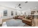Open-concept living area with hardwood floors, a leather sofa, and plenty of natural light at 311 12Th N Ave, St Petersburg, FL 33701