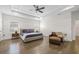 Spacious main bedroom with tray ceiling, hardwood floors, and a comfortable seating area at 311 12Th N Ave, St Petersburg, FL 33701