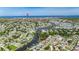 Extended aerial of a charming community with waterfront homes along a winding canal at 318 Lookout Dr, Apollo Beach, FL 33572