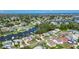 Sprawling aerial perspective of the residential neighborhood dotted with canals, lush vegetation, and cozy homes at 318 Lookout Dr, Apollo Beach, FL 33572