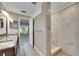The bathroom boasts double sinks and a walk-in shower, all finished with gorgeous tile at 318 Lookout Dr, Apollo Beach, FL 33572