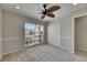 The bedroom features a decorative fan, a window, and a closet at 318 Lookout Dr, Apollo Beach, FL 33572
