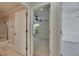 Neutral toned bathroom and bedrooms are split by a doorway at 318 Lookout Dr, Apollo Beach, FL 33572