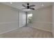 This bedroom has light colored walls and a leafy ceiling fan at 318 Lookout Dr, Apollo Beach, FL 33572