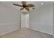 Neutral bedroom featuring a stylish ceiling fan and comfortable carpeting at 318 Lookout Dr, Apollo Beach, FL 33572