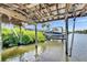 Covered boat lift that provides protection and convenience for boat storage, ensuring easy access to the water at 318 Lookout Dr, Apollo Beach, FL 33572