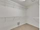 This closet is a blank canvas with metal racks to be organized however you like at 318 Lookout Dr, Apollo Beach, FL 33572