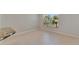 Bright breakfast nook with tile flooring and a window overlooking the backyard at 318 Lookout Dr, Apollo Beach, FL 33572