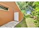 Exterior shot of the home with a storage shed that adds practical storage space and enhances the property's functionality at 318 Lookout Dr, Apollo Beach, FL 33572