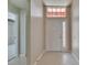 Inviting front foyer featuring tile flooring, a front door with sidelights, and natural light at 318 Lookout Dr, Apollo Beach, FL 33572