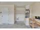 Tidy garage space featuring utility hookups, shelving, and side door access at 318 Lookout Dr, Apollo Beach, FL 33572